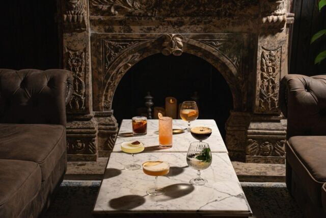 Table with signature drinks in a room for gatherings at The Copper, Murray Hill luxury rental apartments.